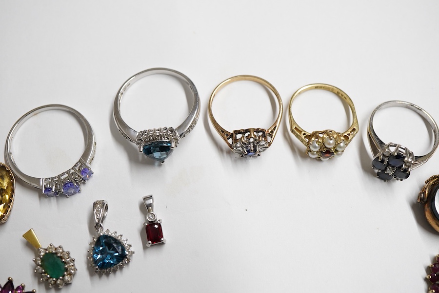 A small group of jewellery to include, four modern 9ct gold and gem set rings including garnet and seed pearl cluster and sapphire and diamond cluster, one other modern 9k and gem set ring, five assorted 9ct and gem set
